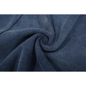 Macro view of blue washed rib-knit fabric texture for distressed bodycon jumpsuit