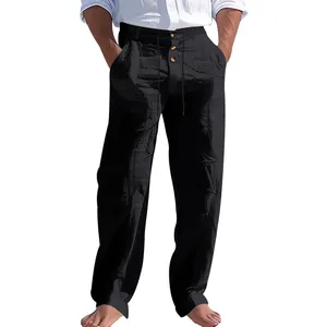 Vista dettagliata dei pantaloni da spiaggia in lino nero da uomo con coulisse e bottoni.