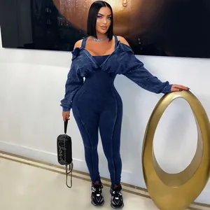 Detail of washed blue off-shoulder slim fit jumpsuit with long sleeves