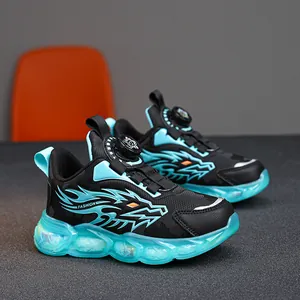 Boy's black and cyan sneakers with dragon flame patterns and rotary buckle closure