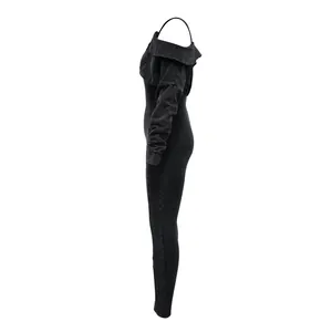 Detail view showing the side profile of a sexy black washed off-shoulder jumpsuit