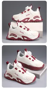 Detailed macro view of kids' sports sneakers featuring red accents and a dial lace system