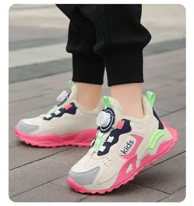 Detail view of children's fleece-lined sneakers with rotary buckle closure on feet.