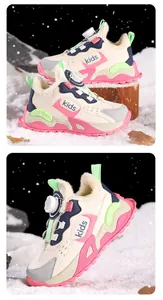 Close-up of kids winter sneakers featuring warm fur lining and rotary buckle closure