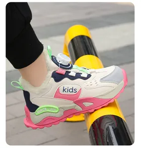 Detail of children's warm winter sneakers with rotary dial lace and faux fur lining