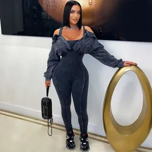 Close-up of grey washed denim jumpsuit with ribbed texture and off-shoulder jacket.