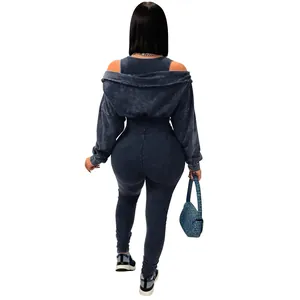 Back view of a washed distressed blue off-shoulder ribbed jumpsuit two-piece set