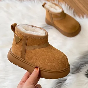 Warm children's faux fur lined snow boots in tan brown with thick non-slip rubber sole