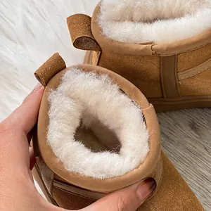 Cozy children's brown snow boots featuring thick white faux fur lining for winter warmth