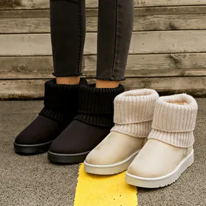 Close-up of women's platform snow boots with knitted fold-over cuffs and warm lining.