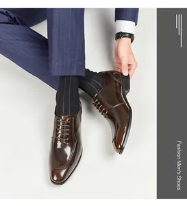 Detailed macro view of polished brown leather men's business dress shoes with square toe