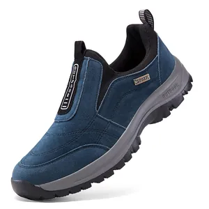 A detailed side view of a blue suede outdoor walking shoe featuring a durable grip sole