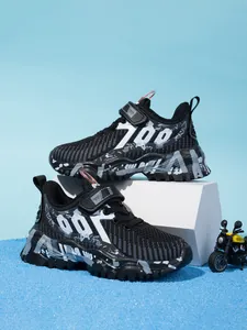 Side view detail of breathable black mesh boys running shoes with 700 pattern