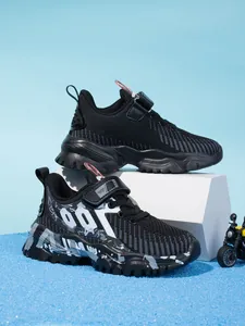 Detailed side view of breathable mesh boys' sneakers featuring stylish sporty graphic patterns