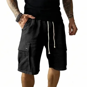 Detailed view of men's black slim fit cargo shorts featuring a functional drawstring waist