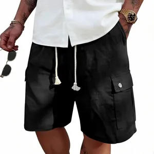 Detail view of men's black summer cargo shorts with drawstring and utility pockets