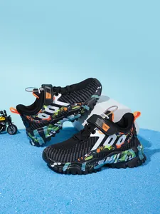 Close-up of breathable mesh boys' running shoes with colorful graffiti and durable soles.