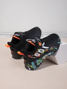 Boys breathable mesh sneakers with colorful graffiti sole and hook-and-loop strap for sport.