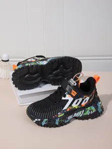 Close-up of boys' breathable mesh sneakers with vibrant graffiti pattern and 700 logo.