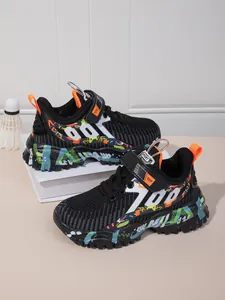 Detailed side view of breathable black mesh boys running shoes with graffiti soles.
