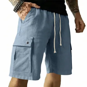 Macro view of blue cargo shorts featuring a drawstring waist and large flap pocket