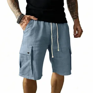 Close-up of men's blue cargo shorts with side flap pockets and drawstring waist