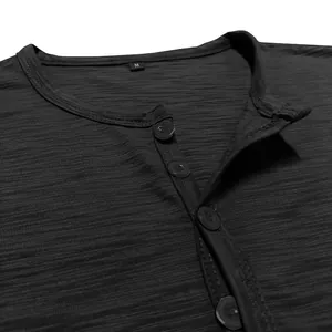 Close-up of men's Henley shirt neckline with button details and textured fabric