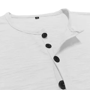 Close-up detail of white slub cotton Henley shirt neckline with black buttons