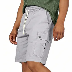 Close-up detail of grey cargo shorts featuring side utility pocket and drawstring waist