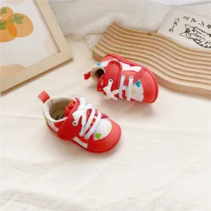 Infant baby walking shoes with red and white heart patterns and soft flexible soles