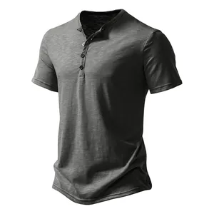 Detailed view of dark grey men's short sleeve Henley shirt with button placket and texture