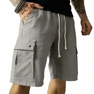 Detail view of grey slim-fit cargo shorts with drawstring and large side flap pockets