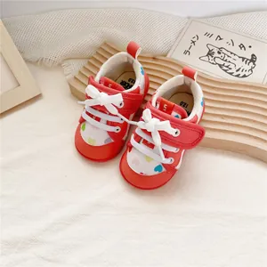 Cute red and white baby walking shoes with colorful heart patterns and white bow details