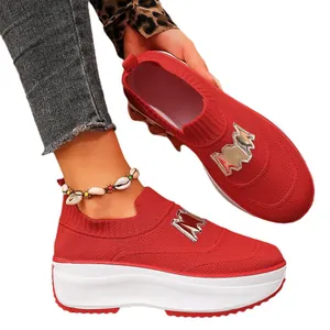 Vibrant red knitted platform sneakers with metallic M detail for women's casual wear.