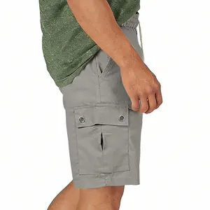 Detailed side view of men's grey cargo shorts featuring functional multi-pocket design.