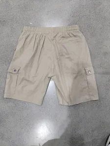 Back view of khaki men's cargo shorts with functional pockets and elastic waist