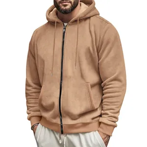 Close-up of men's brown waffle-textured zip-up hoodie with hood and pockets
