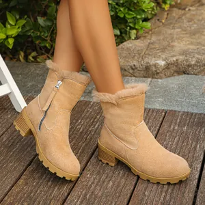 Women's tan suede snow boots with faux fur trim and chunky heel for winter warmth