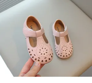 Elegant pink girls' Mary Jane shoes with hollow-out flower pattern and soft soles