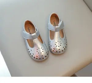Silver girls' Mary Jane princess shoes with hollow-out floral patterns and soft soles.