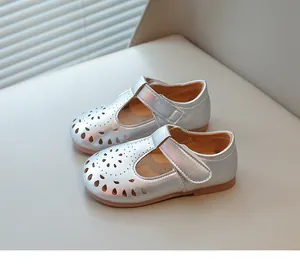 Elegant silver hollow-out girl's princess shoes with T-strap and soft sole, top view