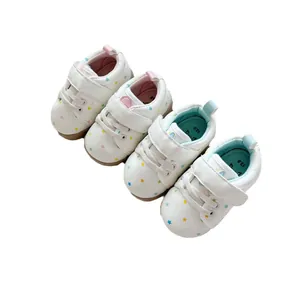 Soft-sole white baby walking shoes with colorful star and heart patterns for toddlers