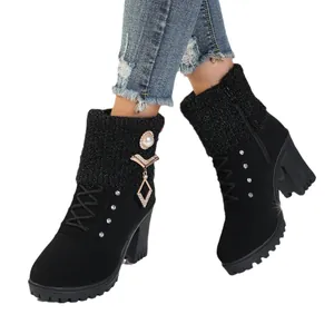 Elegant black winter ankle boots featuring knit cuffs and decorative pearl rhinestone charms