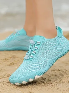 Quick-dry aqua water shoes in light blue with wave pattern for beach and surfing