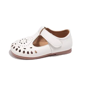 White hollow-out Mary Jane shoes for girls with soft sole and Velcro strap.