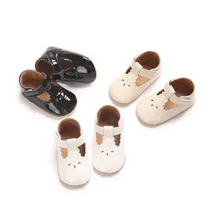 High-quality detail view of baby princess shoes in glossy black, beige and white colors