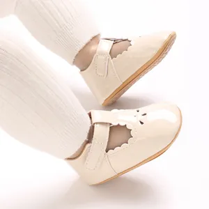 Close-up of beige baby princess shoes with non-slip rubber sole and Velcro strap
