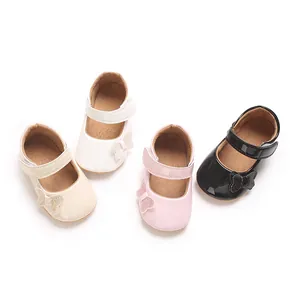Detailed view of glossy baby girl Mary Jane shoes with butterfly accents in four colors