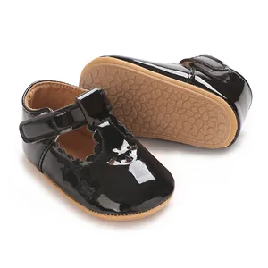 Detailed view of baby Mary Jane shoes with black patent leather and non-slip rubber sole