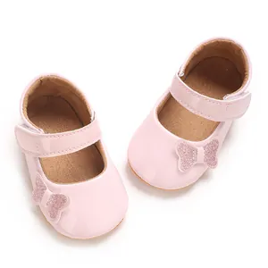 Pink baby girl princess shoes with glitter butterfly detail for newborns aged 0-1 year.